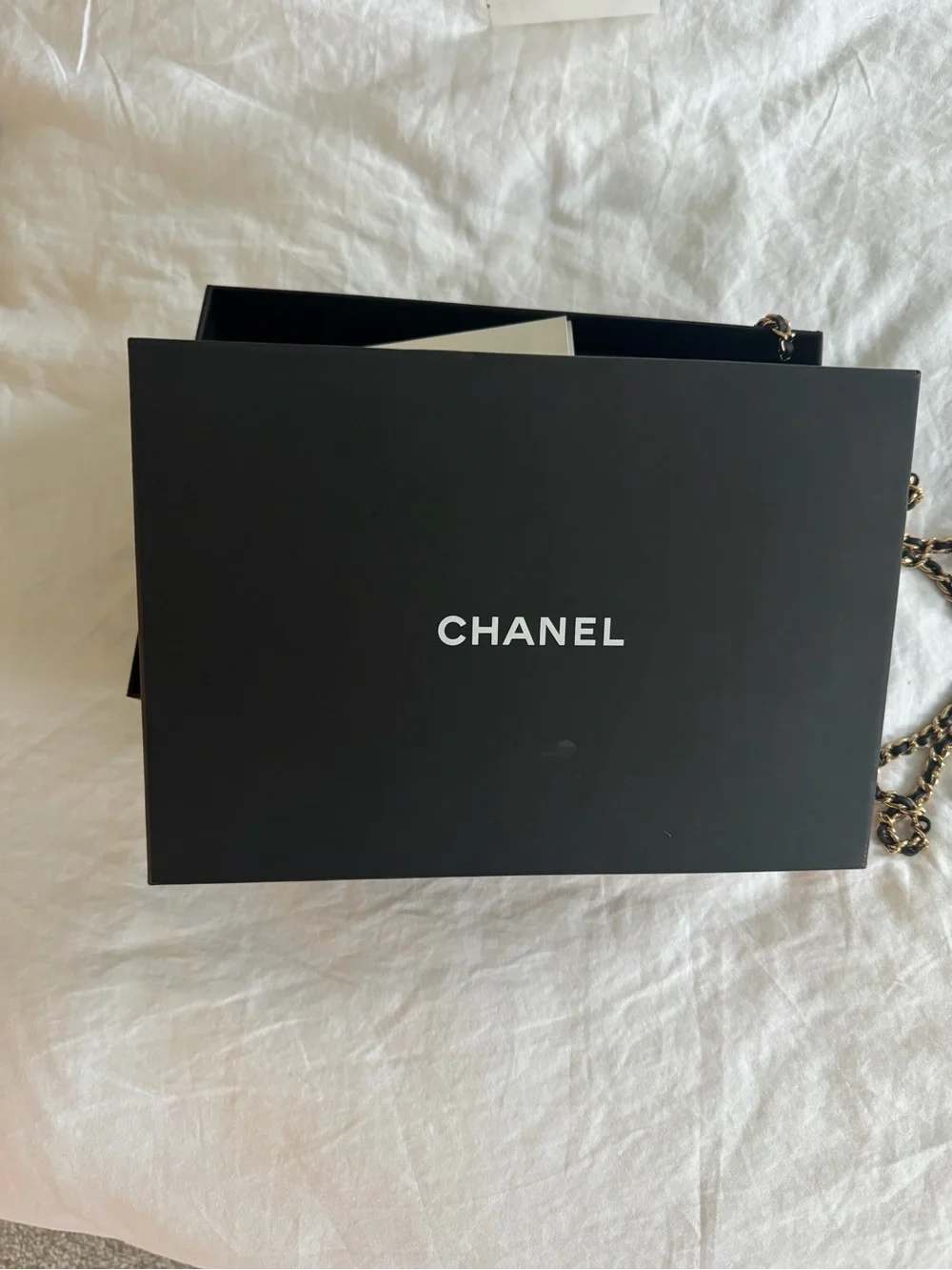 CHANEL Black Leather Wallet with Gold Chain Accent